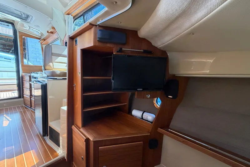 Slide: The Image of Interior of 2020 Ranger Tugs R-29 S with wood finish and mounted TV. - 20