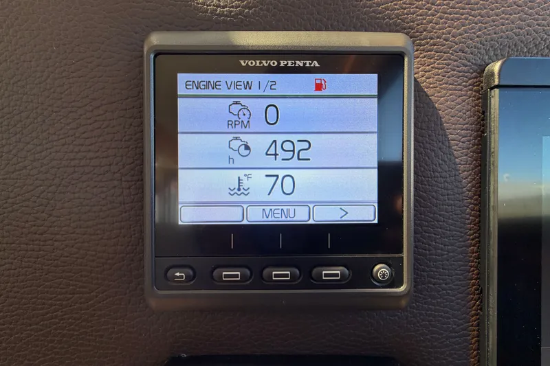 Slide: The Image of Volvo Penta engine display showing RPM, hours, and temperature on Ranger Tugs R-29 S, 2020 model. - 17