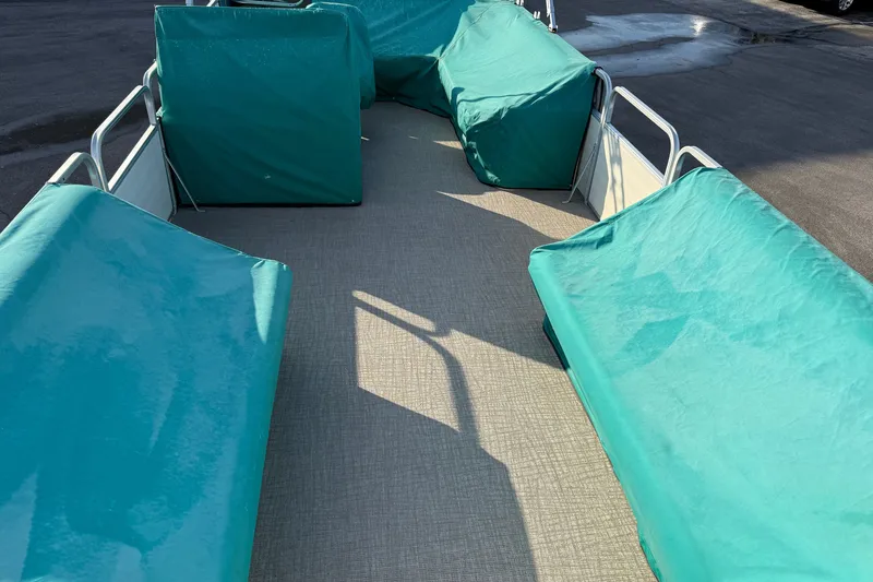 Slide: The Image of Pontoon boat interior with teal covers, Lowe Family 245, 1998 model. - 22