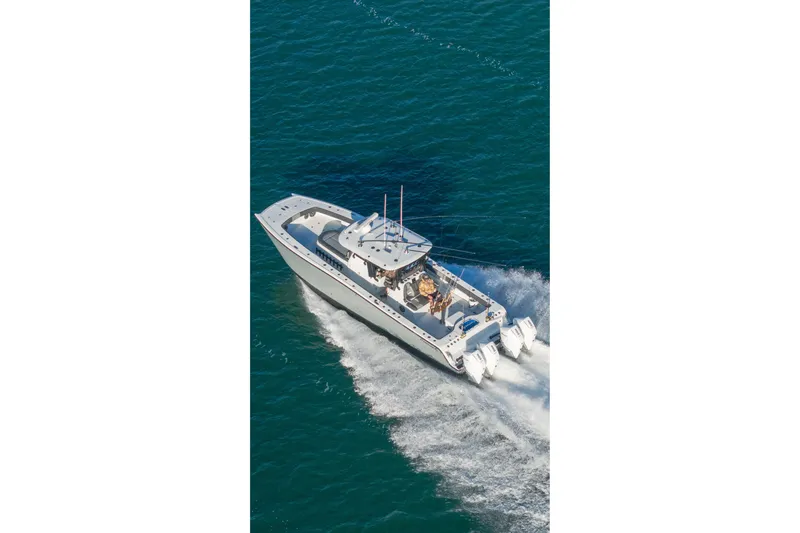 Slide: The Image of 2024 Freeman 38 boat cruising on open water, showcasing sleek design and powerful engines. - 1