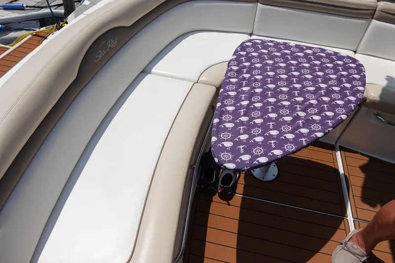 Slide: The Image of Luxurious seating area on a 2013 Sea Ray Sundancer 370 yacht with nautical-themed table cover. - 14