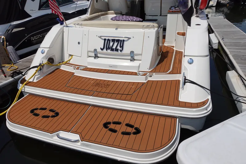 Slide: The Image of 2013 Sea Ray Sundancer 370 yacht with teak deck, docked at marina. - 4