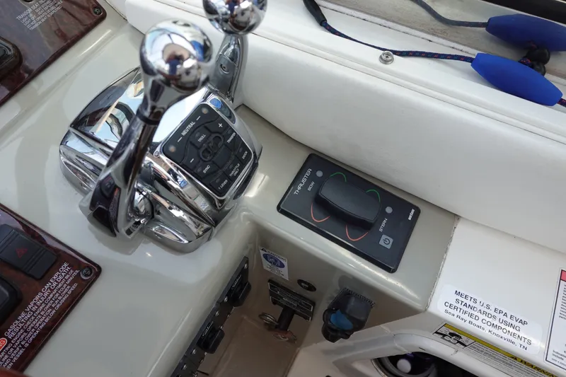 Slide: The Image of Control panel of a 2013 Sea Ray Sundancer 370 boat with throttle and thruster controls. - 11