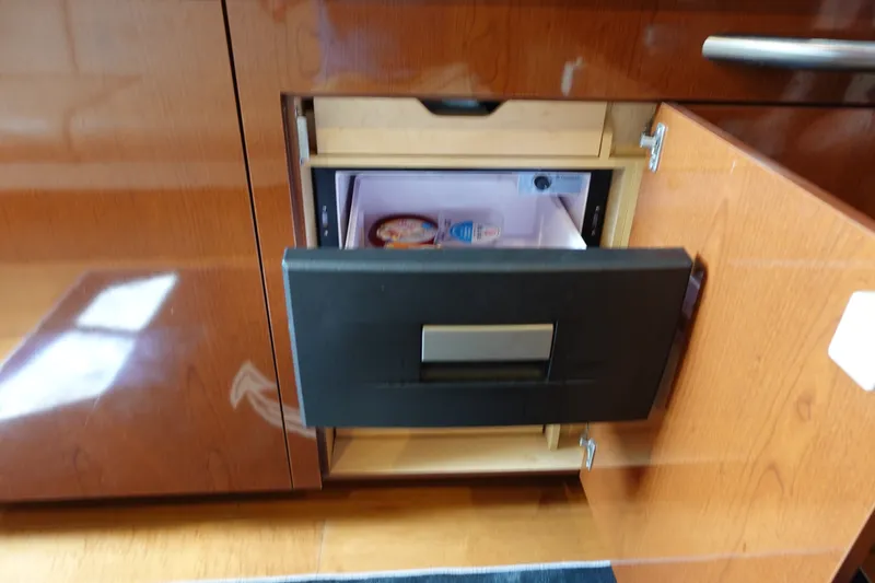 Slide: The Image of Built-in refrigerator drawer on 2013 Sea Ray Sundancer 370 yacht interior. - 25