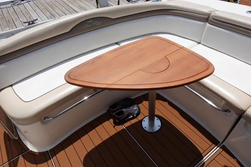 Slide: The Image of Luxurious seating area on 2013 Sea Ray Sundancer 370 yacht with wooden table. - 13