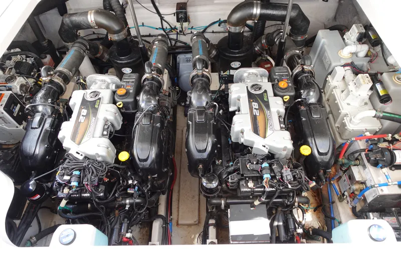 Slide: The Image of Engine compartment of a 2013 Sea Ray Sundancer 370, showcasing dual inboard motors. - 35