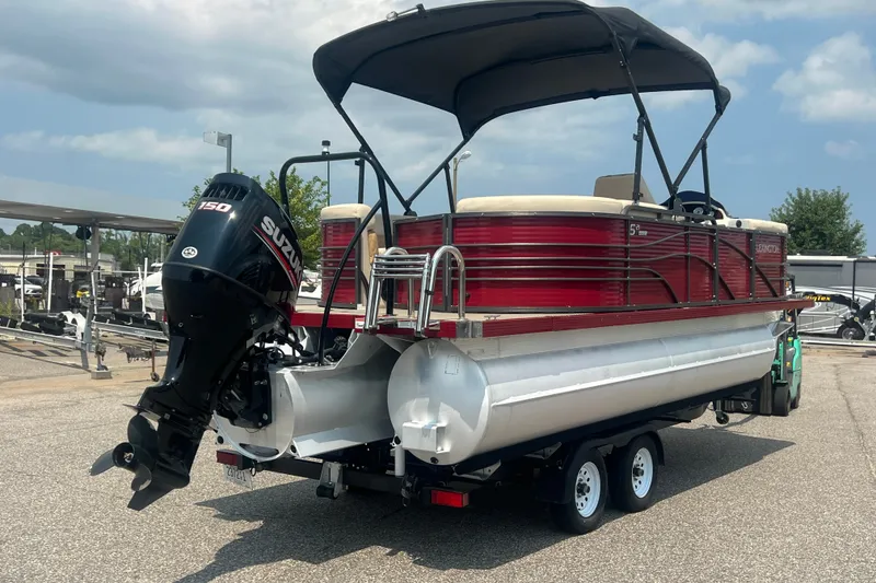 Slide: The Image of 2020 Lexington 521 pontoon boat with Suzuki 150 engine on trailer. - 29