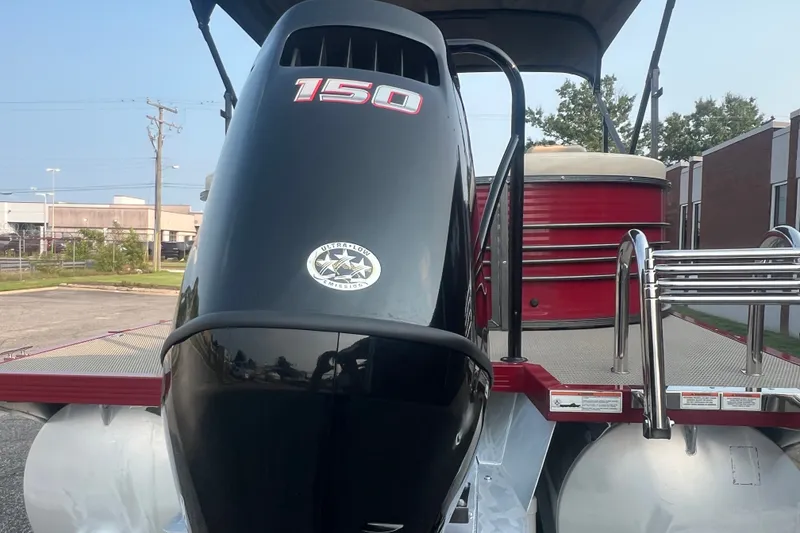 Slide: The Image of 2020 Lexington 521 boat with 150 horsepower engine, parked outdoors. - 4