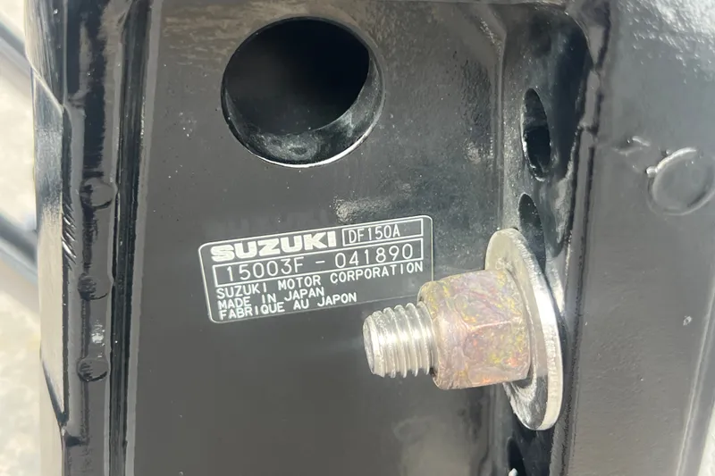 Slide: The Image of Close-up of a Suzuki DF150A engine part with serial number, Lexington 521, 2020 model. - 26