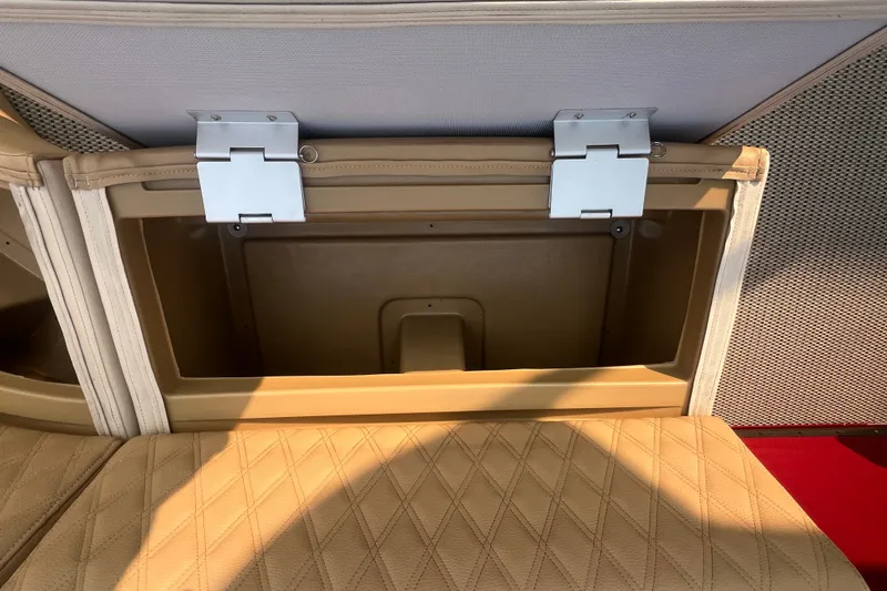 Slide: The Image of Open storage compartment in 2020 Lexington 521 boat with beige upholstery. - 11