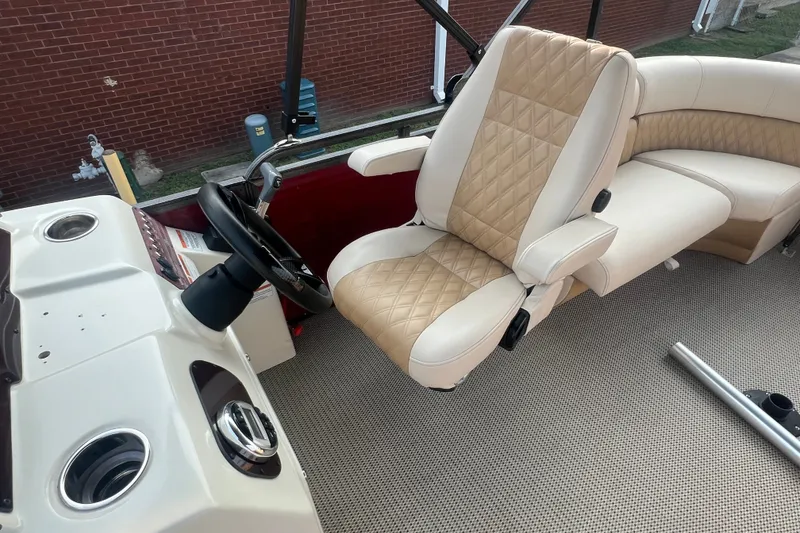 Slide: The Image of Luxurious interior of a 2020 Lexington 521 boat with beige quilted seating. - 19