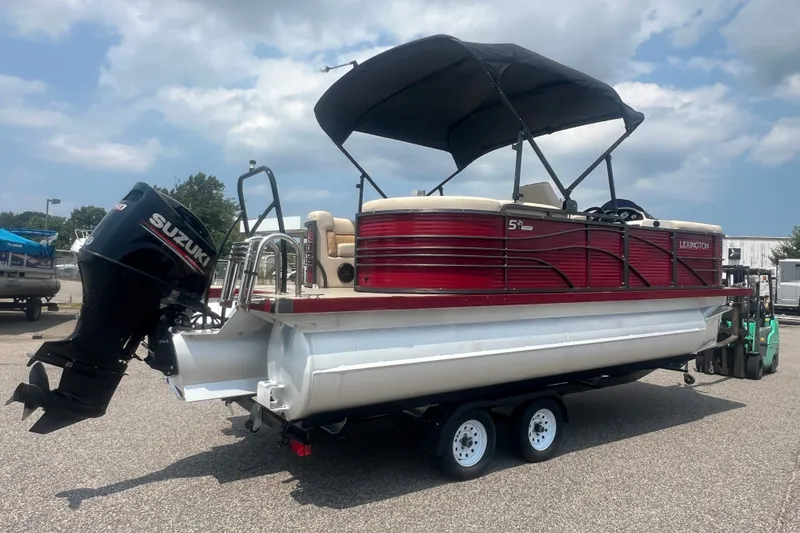 Slide: The Image of 2020 Lexington 521 pontoon boat with Suzuki outboard motor on trailer. - 34