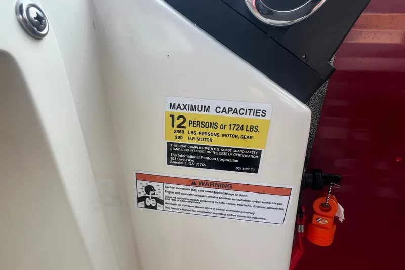 Slide: The Image of 2020 Lexington 521 boat capacity label, maximum 12 persons or 1724 lbs, safety warning included. - 23