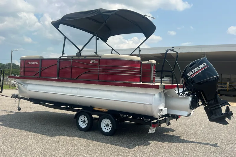 Slide: The Image of 2020 Lexington 521 pontoon boat with Suzuki outboard motor on trailer. - 32