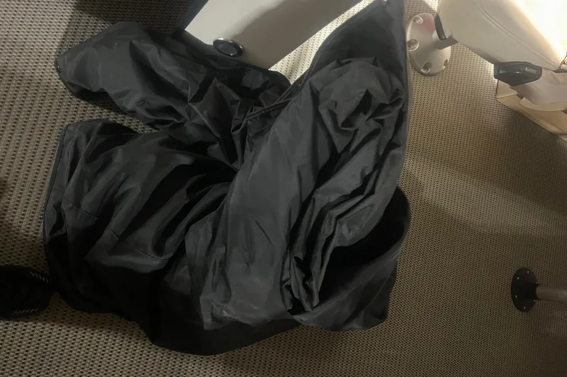 Slide: The Image of Black fabric on carpeted floor inside 2020 Lexington 521 boat interior. - 36