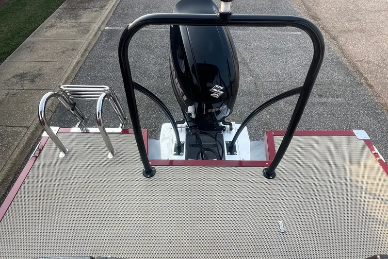Slide: The Image of 2020 Lexington 521 boat with Suzuki outboard motor and swim ladder on deck. - 22