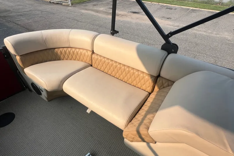 Slide: The Image of Luxurious beige seating on 2020 Lexington 521 boat, featuring diamond-patterned upholstery. - 21