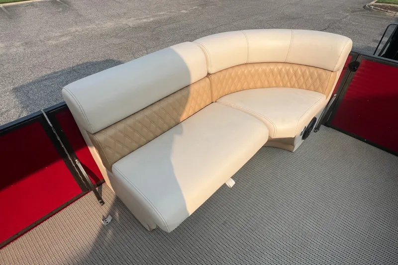 Slide: The Image of Luxurious beige seating on 2020 Lexington 521 boat, featuring diamond-pattern upholstery. - 17