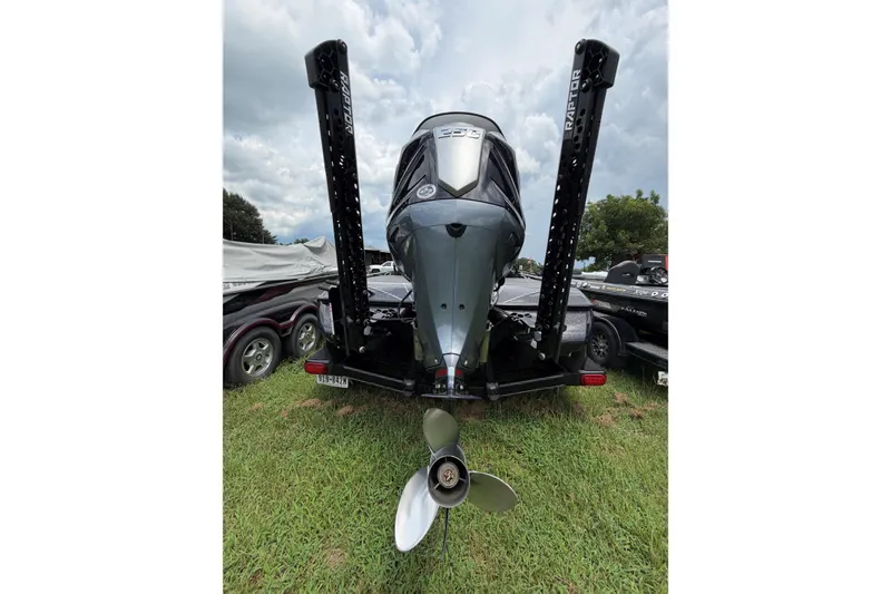 Slide: The Image of 2025 Skeeter FXR21 PRO boat rear view with motor and Raptor anchors. - 10