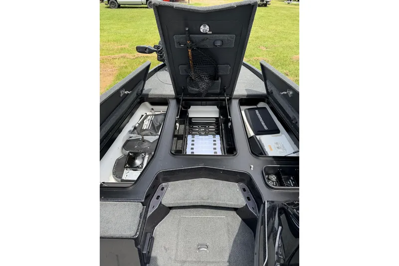Slide: The Image of 2025 Skeeter FXR21 PRO boat storage compartments with fishing gear and equipment. - 7