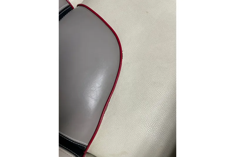 Slide: The Image of Close-up of 2013 Malibu Wakesetter 20 MXZ boat seat with red trim. - 22