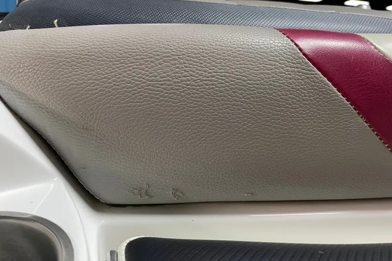 Slide: The Image of 2013 Malibu Wakesetter 20 MXZ boat seat with red and gray upholstery detail. - 24