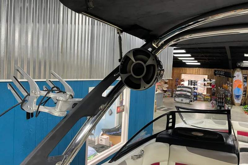Slide: The Image of 2013 Malibu Wakesetter 20 MXZ boat interior with speaker and wakeboard rack. - 16