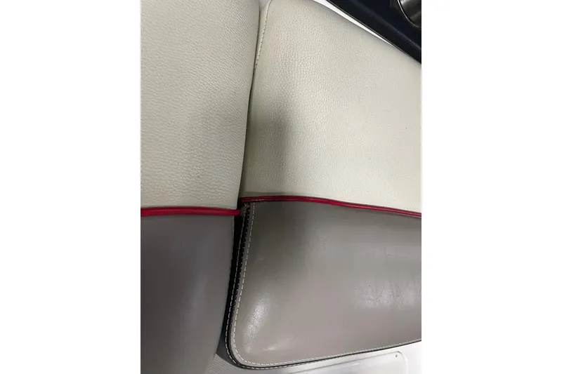 Slide: The Image of Close-up of 2013 Malibu Wakesetter 20 MXZ boat upholstery with red trim. - 17