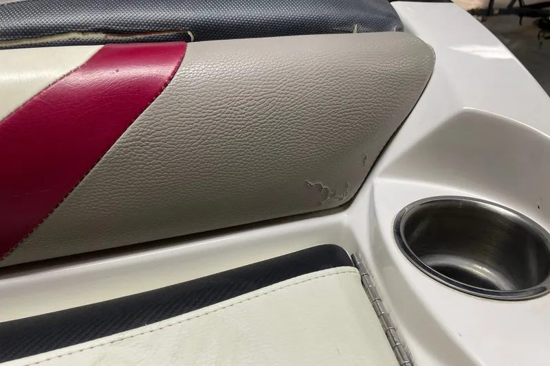 Slide: The Image of 2013 Malibu Wakesetter 20 MXZ boat seat with wear and cup holder. - 18