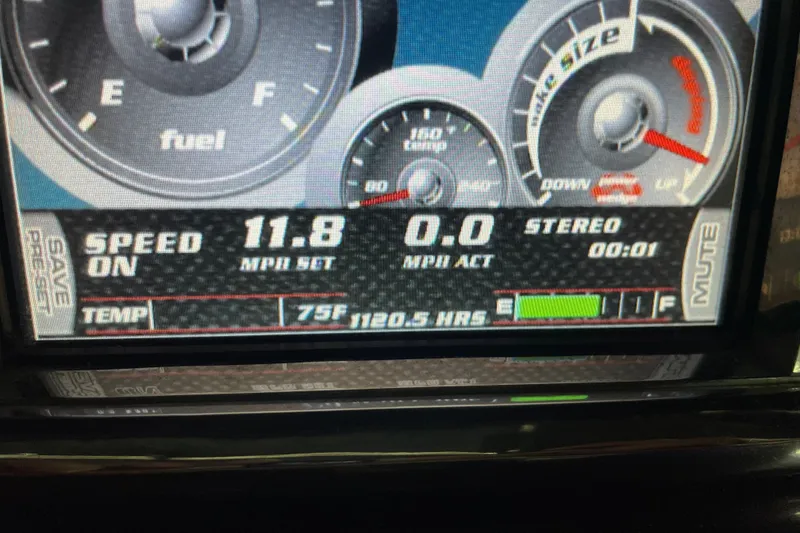 Slide: The Image of Dashboard display of a 2013 Malibu Wakesetter 20 MXZ showing speed, fuel, and temperature. - 14