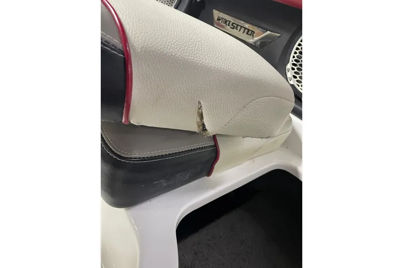 Slide: The Image of 2013 Malibu Wakesetter 20 MXZ interior with torn white upholstery detail. - 23