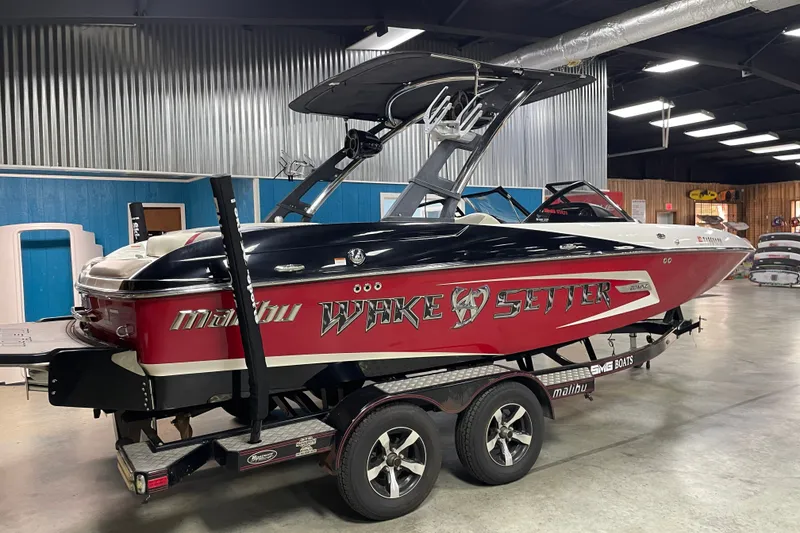 The Image of 2013 Malibu Wakesetter 20 MXZ boat on trailer in indoor showroom. - 1