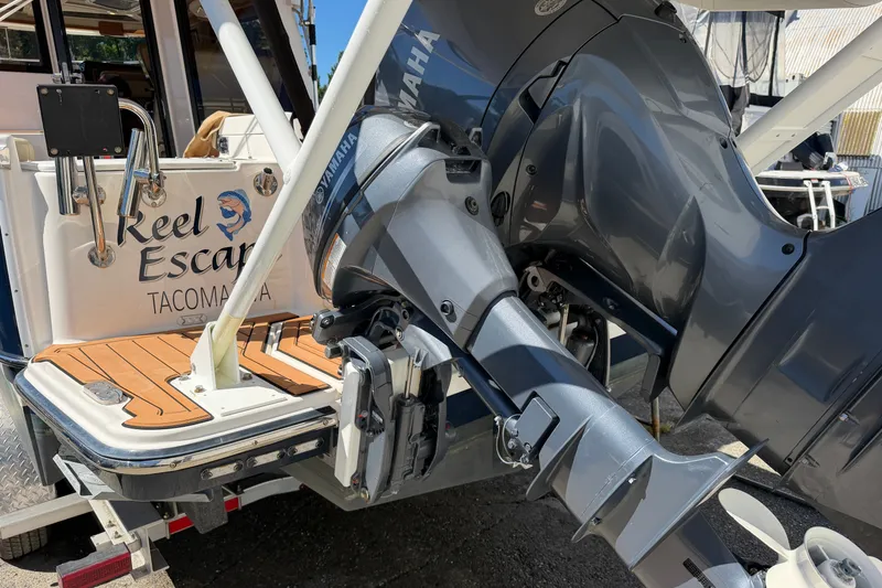Slide: The Image of 2022 Ranger Tugs R-27 boat with Yamaha outboard motor, docked in Tacoma. - 4