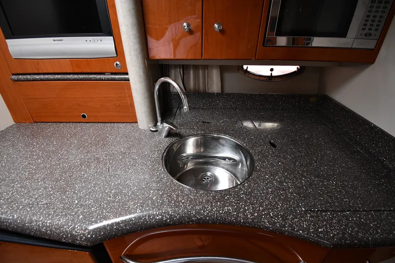 Slide: The Image of 2006 Formula 40 Performance Cruiser kitchen with sleek countertop and stainless steel sink. - 38