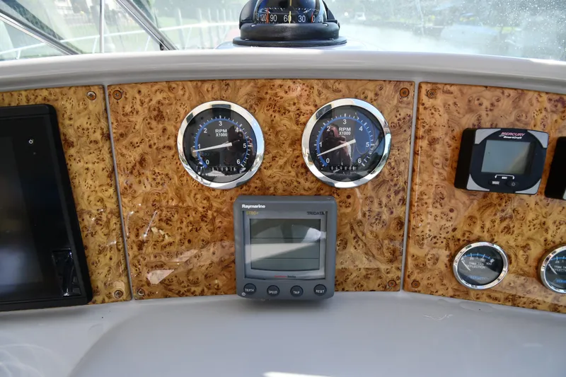 Slide: The Image of Dashboard of a 2006 Formula 40 Performance Cruiser with gauges and navigation equipment. - 15