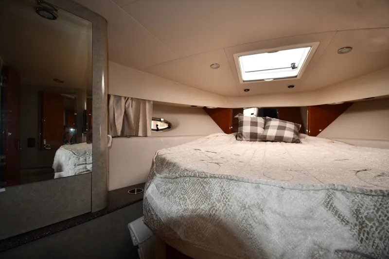 Slide: The Image of Interior cabin of a 2006 Formula 40 Performance Cruiser with bed and skylight. - 31