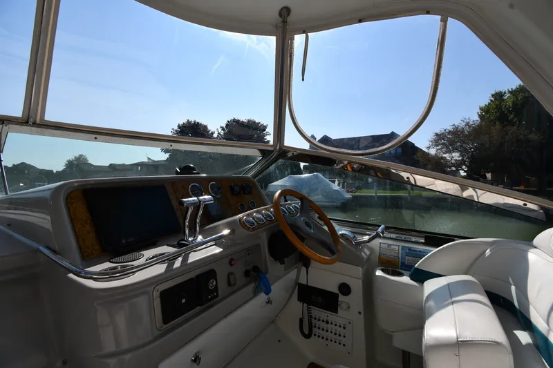 Slide: The Image of Interior view of 2006 Formula 40 Performance Cruiser cockpit with steering wheel and controls. - 13