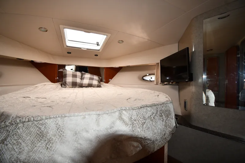 Slide: The Image of Interior of 2006 Formula 40 Performance Cruiser with bed, pillows, TV, and skylight. - 30