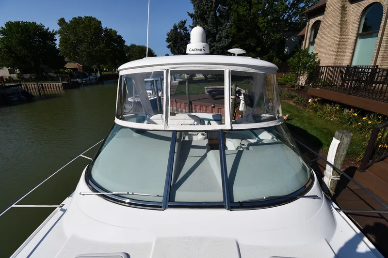 Slide: The Image of 2006 Formula 40 Performance Cruiser docked by a scenic waterfront home. - 10