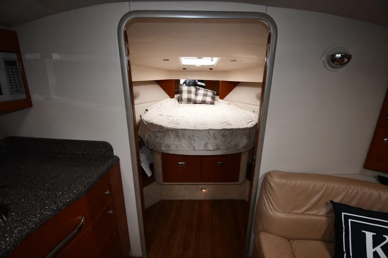 Slide: The Image of Interior cabin of a 2006 Formula 40 Performance Cruiser with cozy bed and modern amenities. - 28