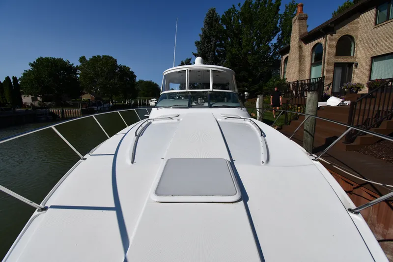 Slide: The Image of 2006 Formula 40 Performance Cruiser docked near waterfront homes. - 9
