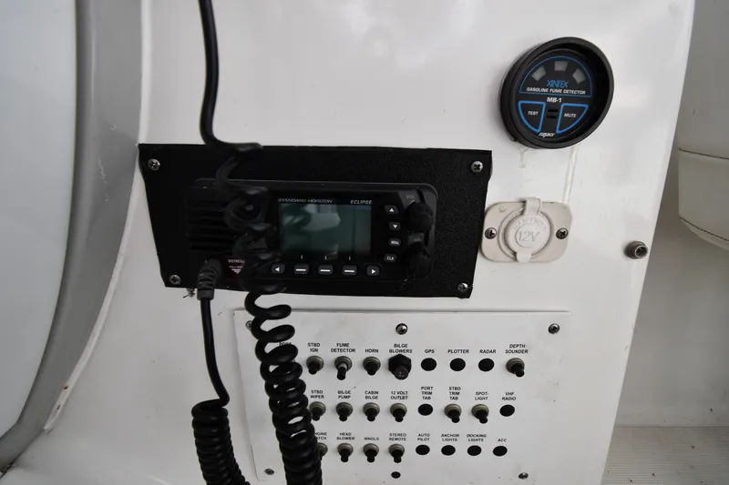 Slide: The Image of Control panel of a 2006 Formula 40 Performance Cruiser with radio and fume detector. - 18