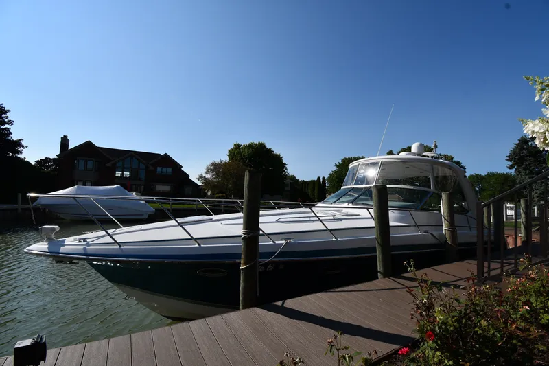 Slide: The Image of 2006 Formula 40 Performance Cruiser docked by a wooden pier on a sunny day. - 3