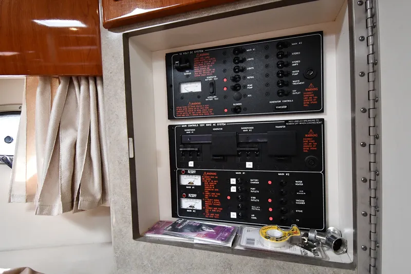 Slide: The Image of Electrical control panel inside a 2006 Formula 40 Performance Cruiser yacht cabin. - 49