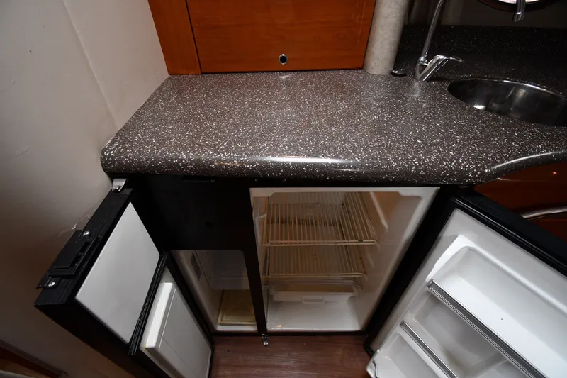 Slide: The Image of Open mini fridge in 2006 Formula 40 Performance Cruiser kitchen area. - 40