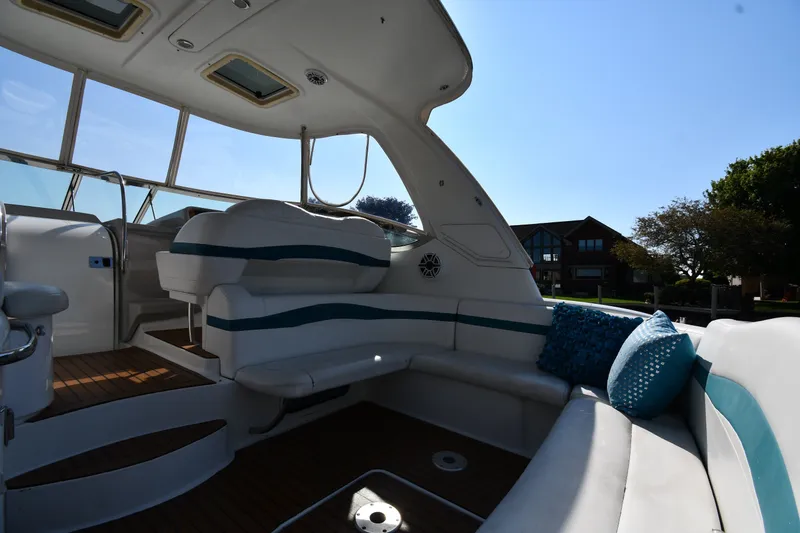 Slide: The Image of Interior of a 2006 Formula 40 Performance Cruiser with plush seating and decorative pillows. - 20
