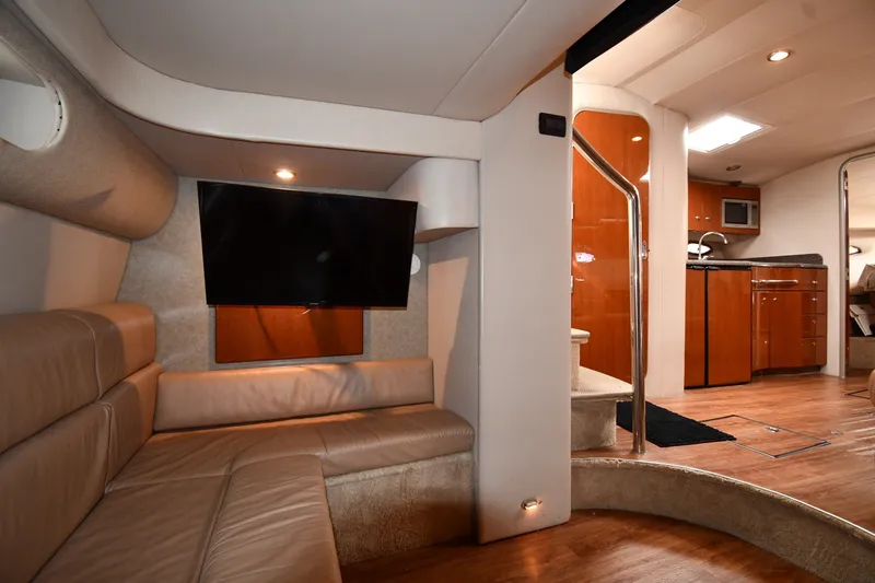 Slide: The Image of Interior of a 2006 Formula 40 Performance Cruiser with leather seating and modern kitchen amenities. - 47