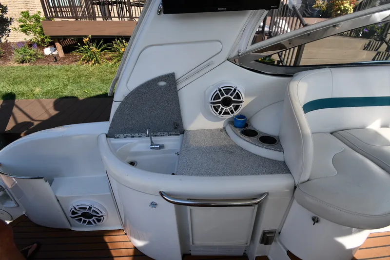 Slide: The Image of 2006 Formula 40 Performance Cruiser interior with sink, seating, and speaker on deck. - 24