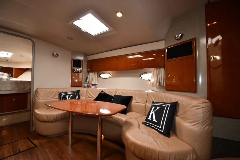 Slide: The Image of Luxurious interior of a 2006 Formula 40 Performance Cruiser with plush seating and elegant wood finishes. - 34