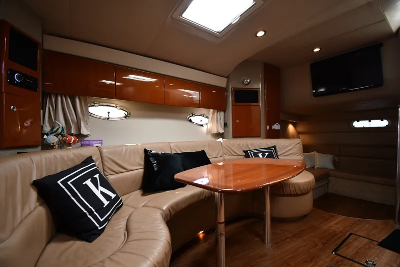 Slide: The Image of Luxurious interior of a 2006 Formula 40 Performance Cruiser with leather seating and wooden table. - 37